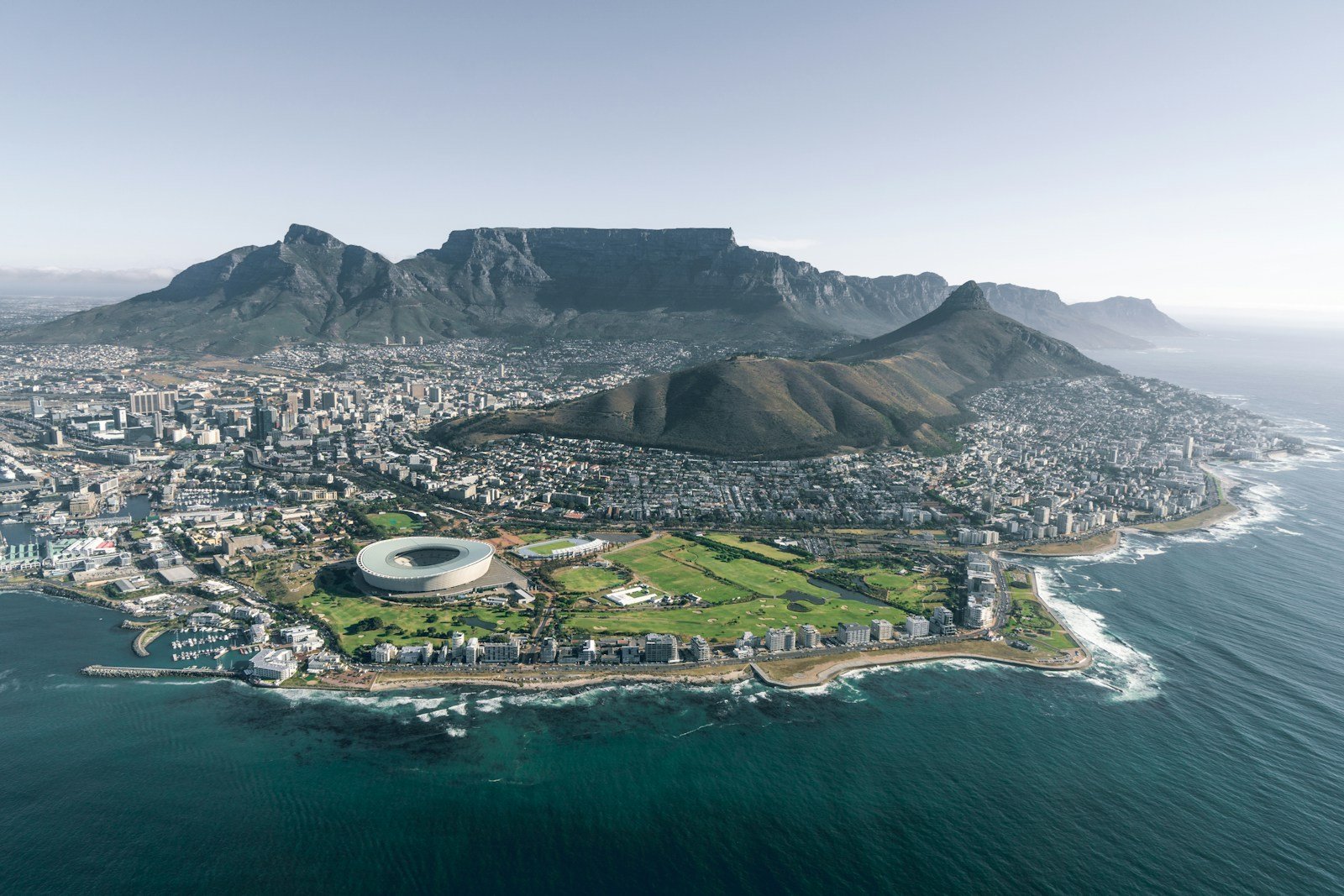 south africa travel guide aerial view of city near mountain during daytime