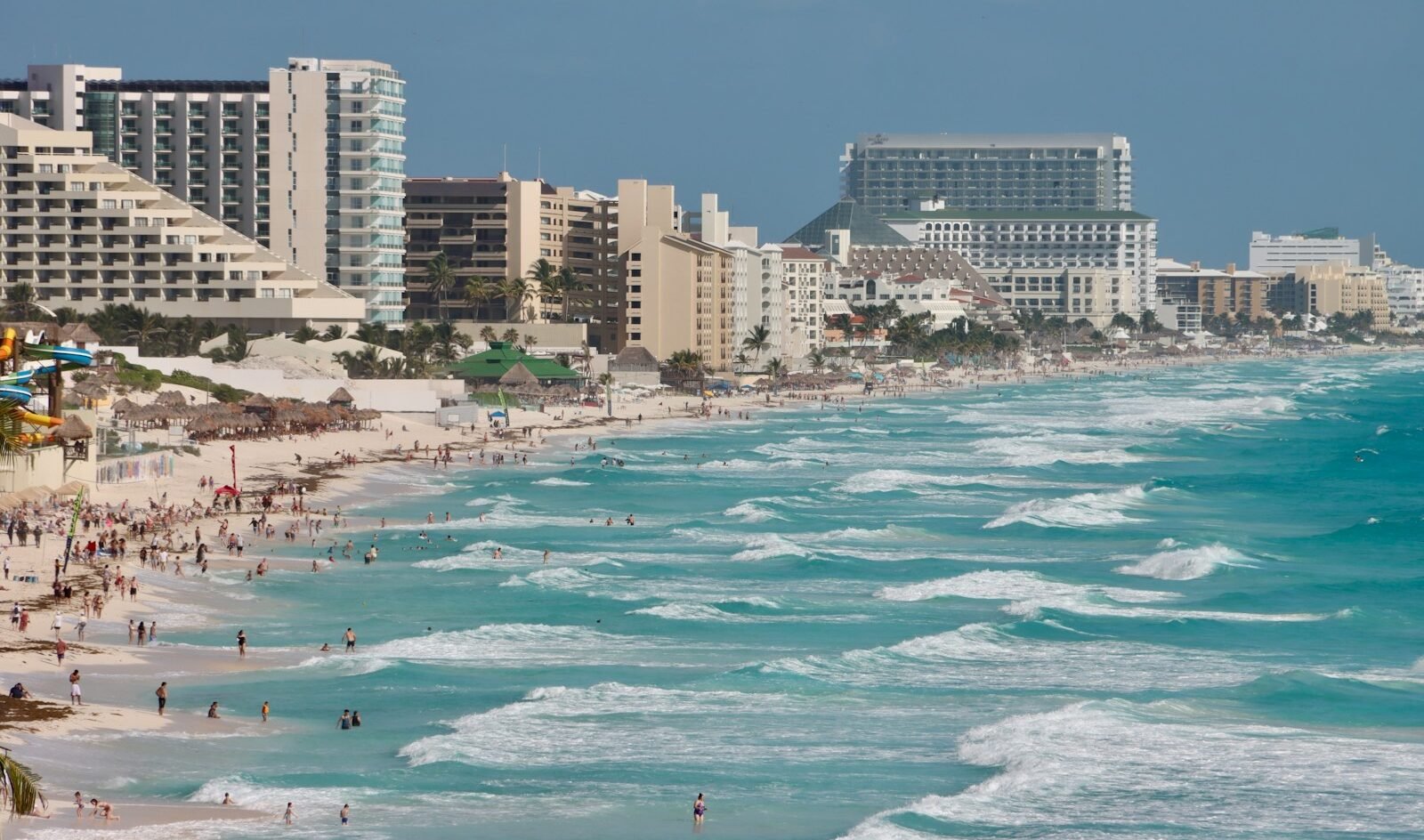 A beach with a bunch of people on it