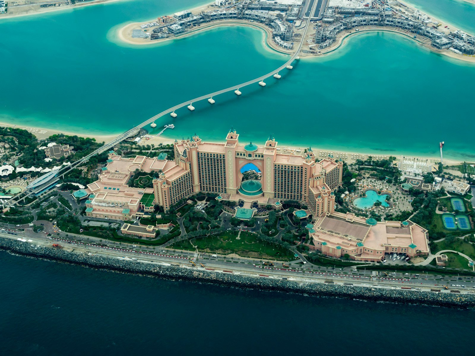 Cheap Hotel Deals aerial photography of concrete buildings on the middle of the sea