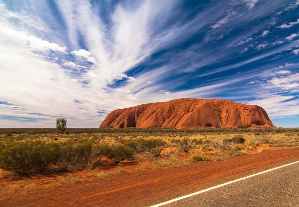 Uluru, Petermann, Australia landscape photography of mountain under blue sky
