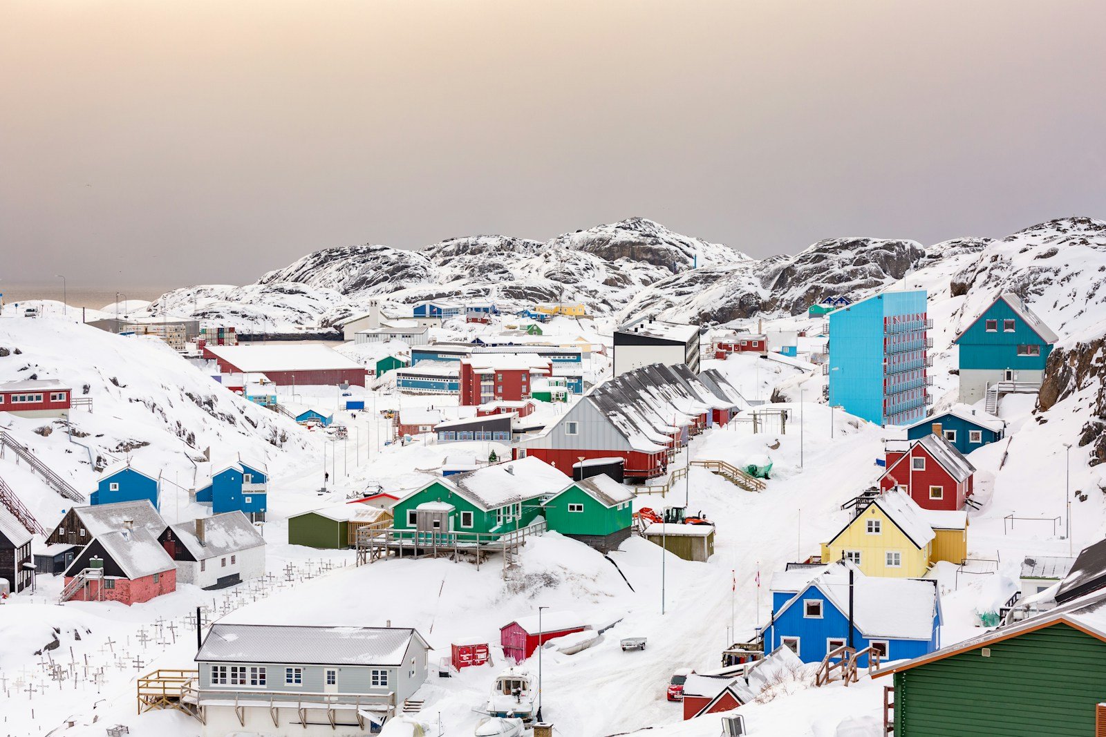 greenland travel guide town on hill covered with snow