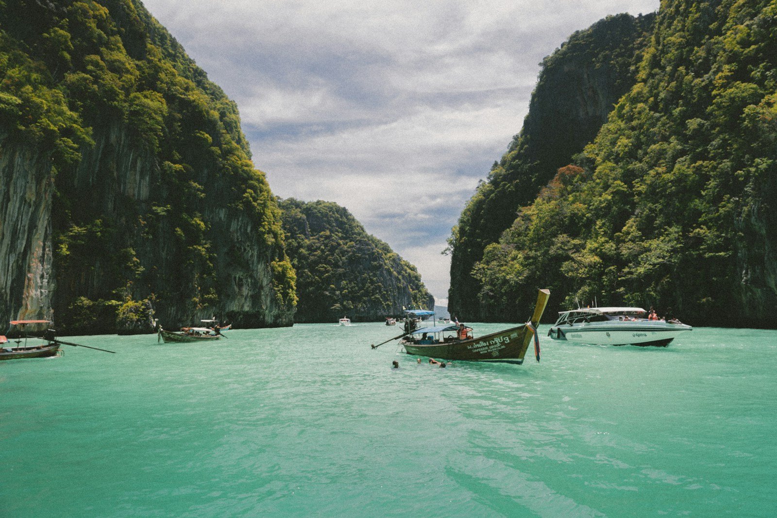 vietnam travel guide four wooden boat on teal sea