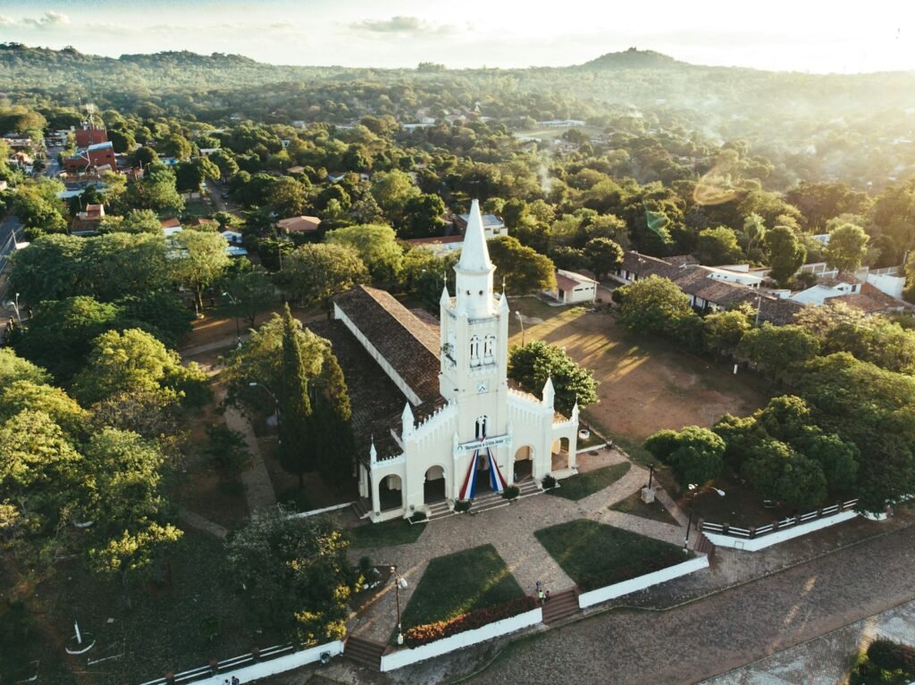 Aregua, Asunción, Paraguay
white and black church surrounded by green trees during daytime