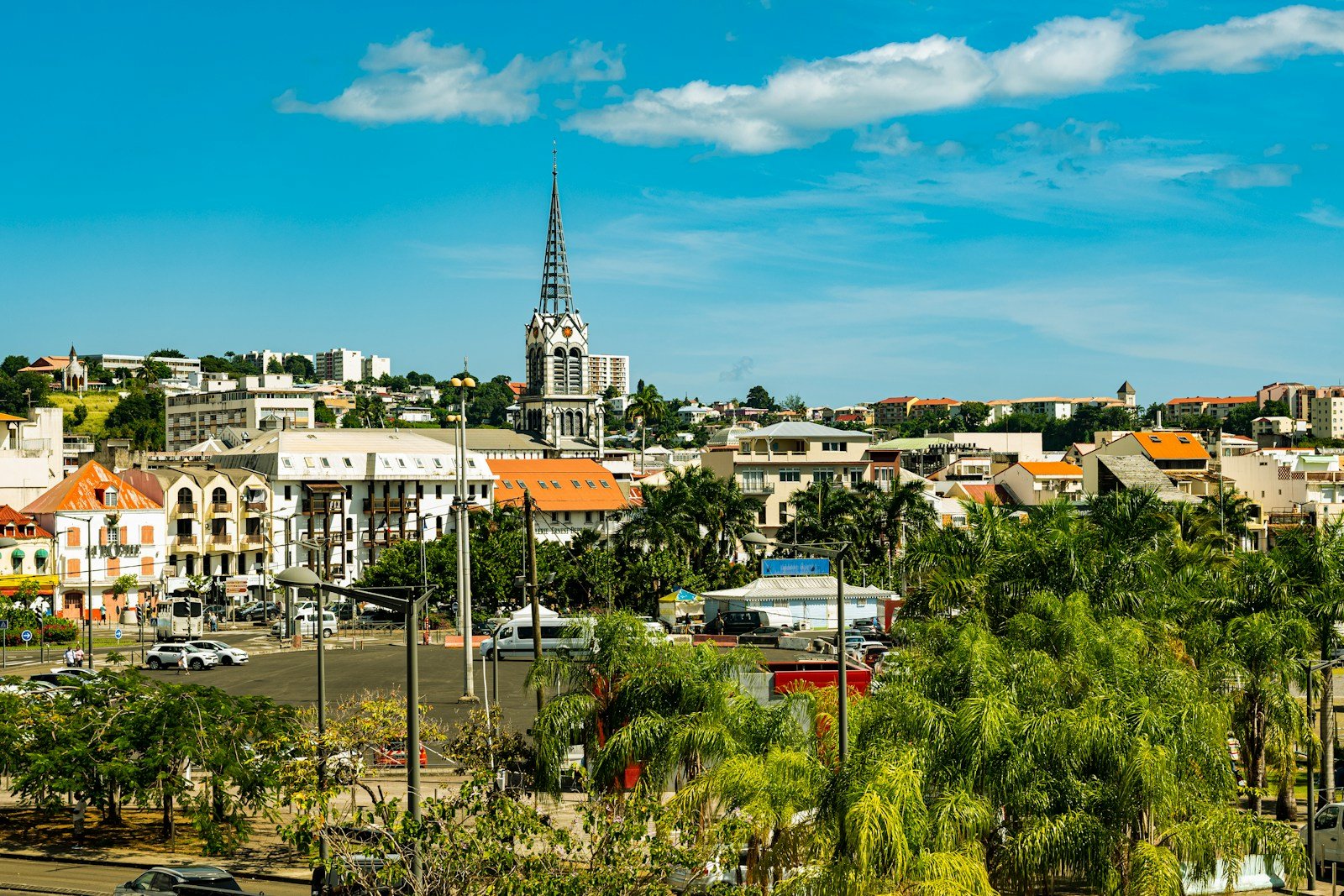 Martinique Travel Guide, a view of a city with a church steeple in the background