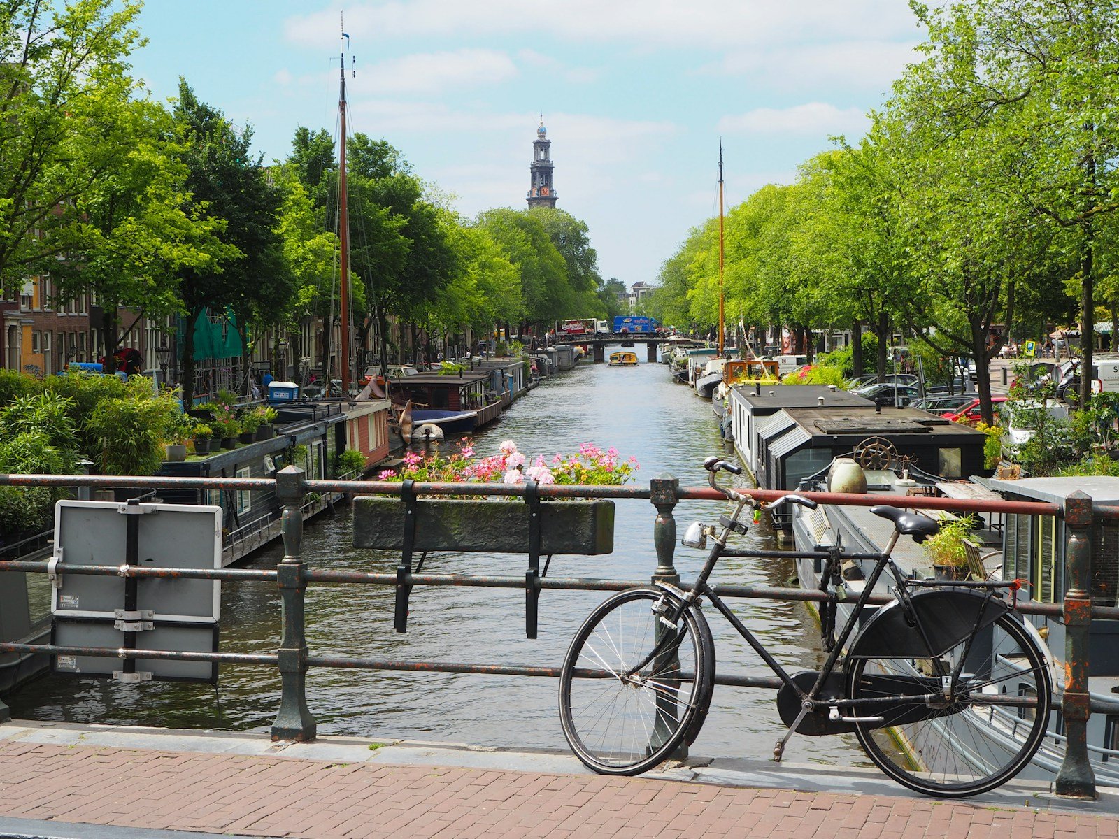 netherlands travel guide black city bike parked beside river during daytime