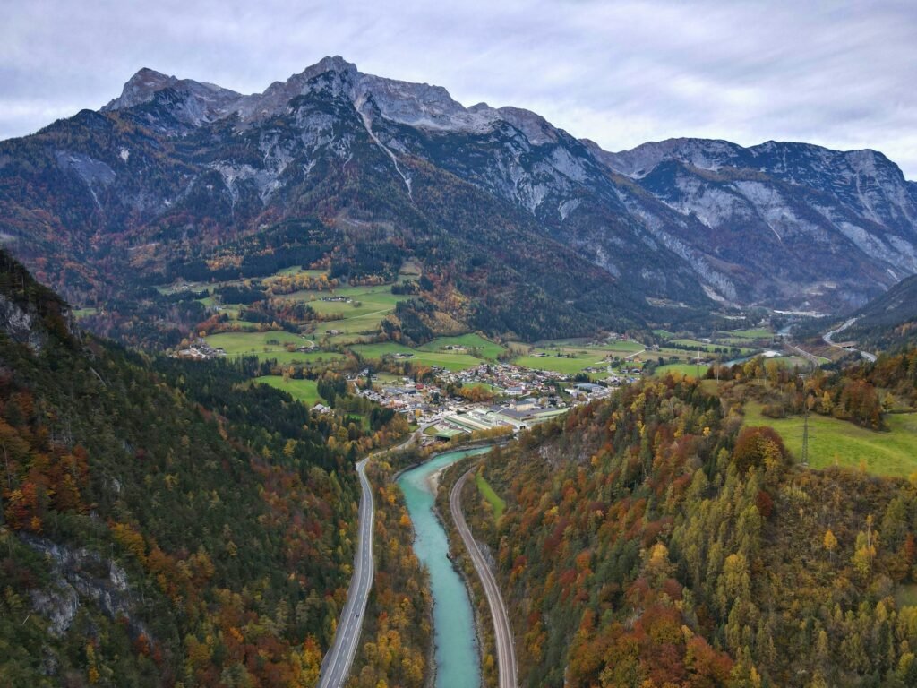 Hohenwerfen Castle, Burgstraße, Werfen, Austria a river running through a valley surrounded by mountains