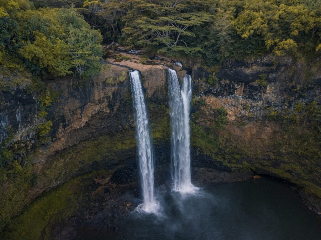 Wailua Falls, kauai United States
waterfalls surrounded by trees