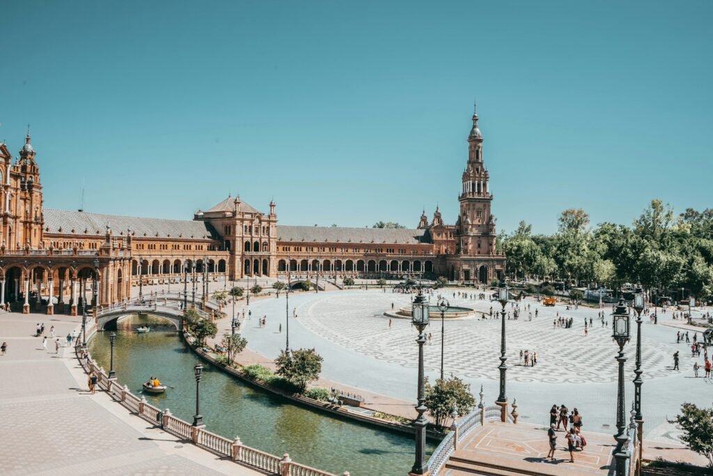 Plaza de España, Sevilla, Spain brown and gray castle near gray lamp