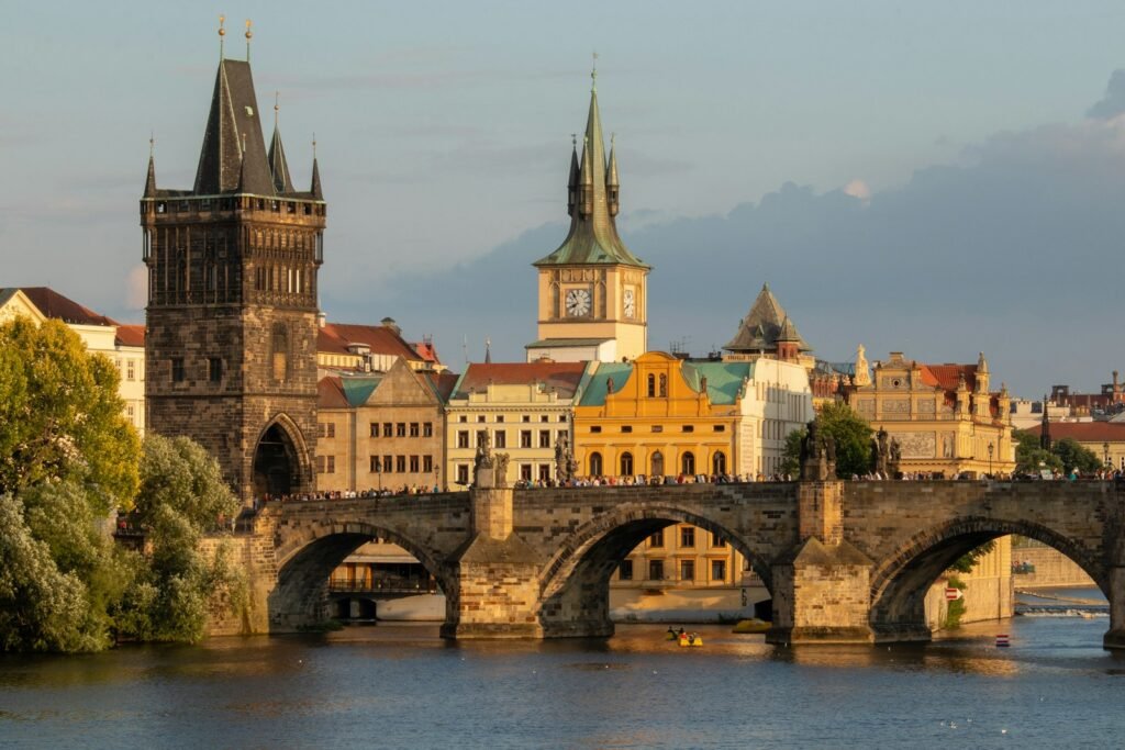 prague gray concrete bridge near buildings