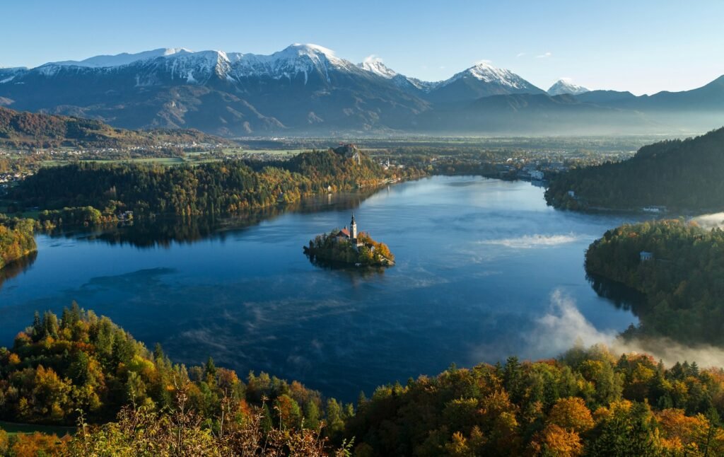 Bled, Slovenia island surrounded by water and mountains at daytime