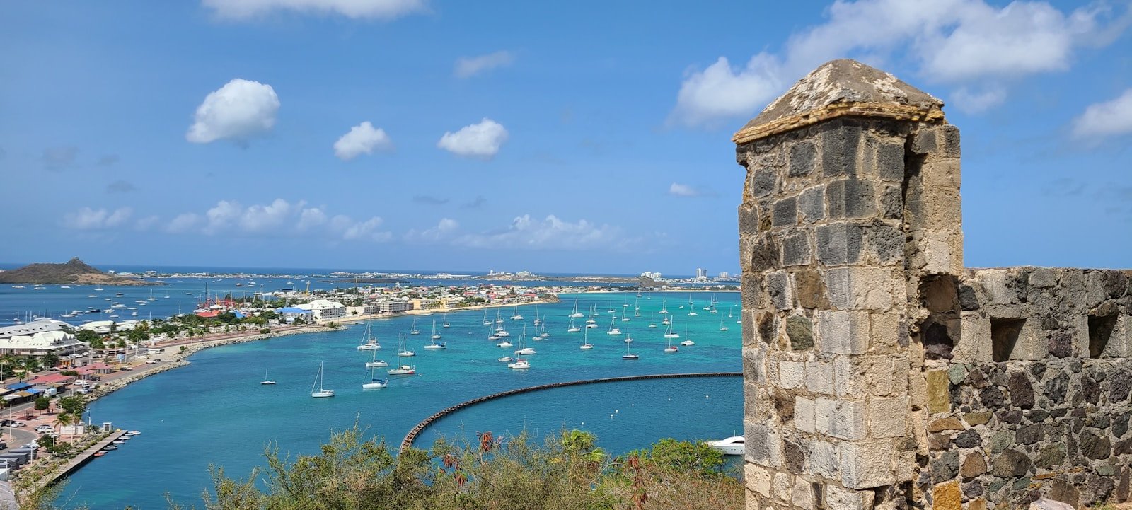 St Martin Tours a stone wall with a body of water and boats in it