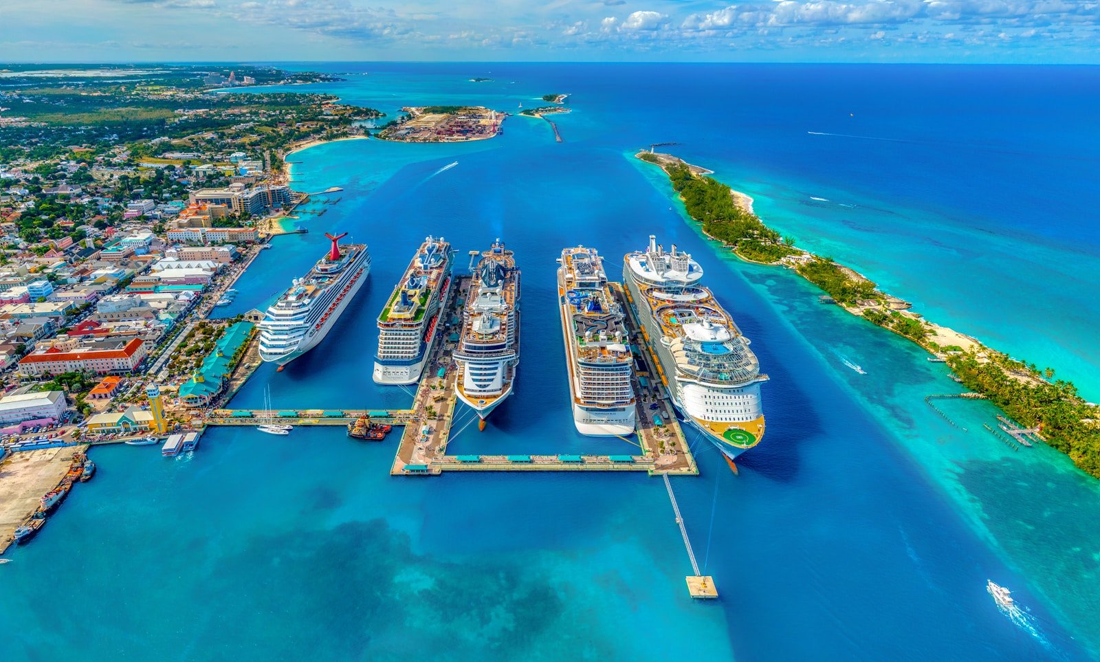 cruise direct aerial photography of white and blue cruise ships during daytime