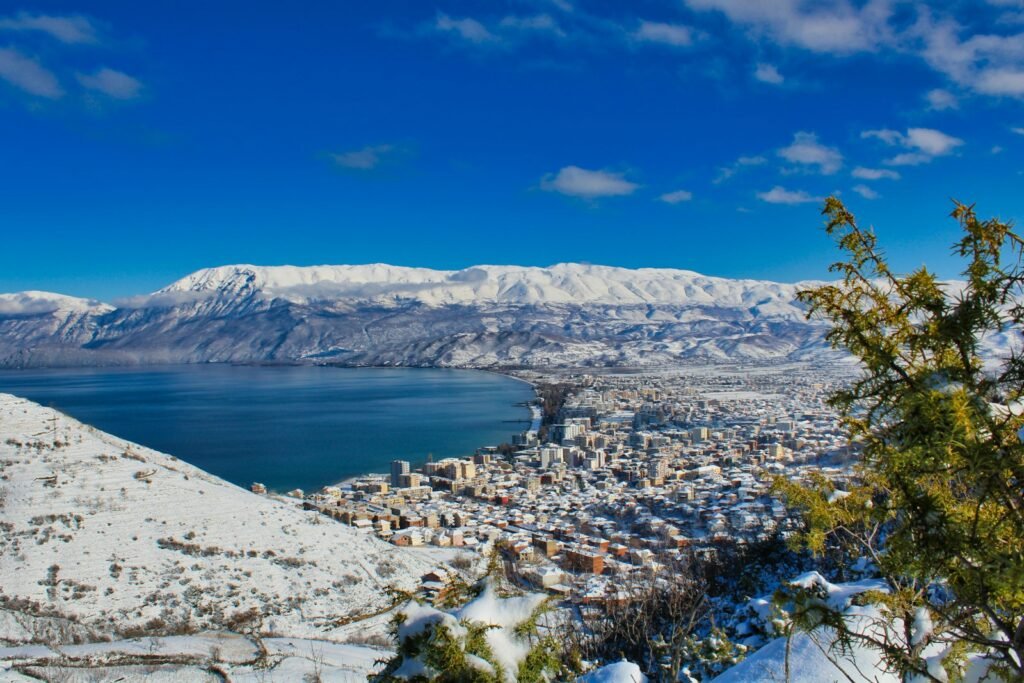 Pogradec, Albania aerial view of city near body of water during daytime