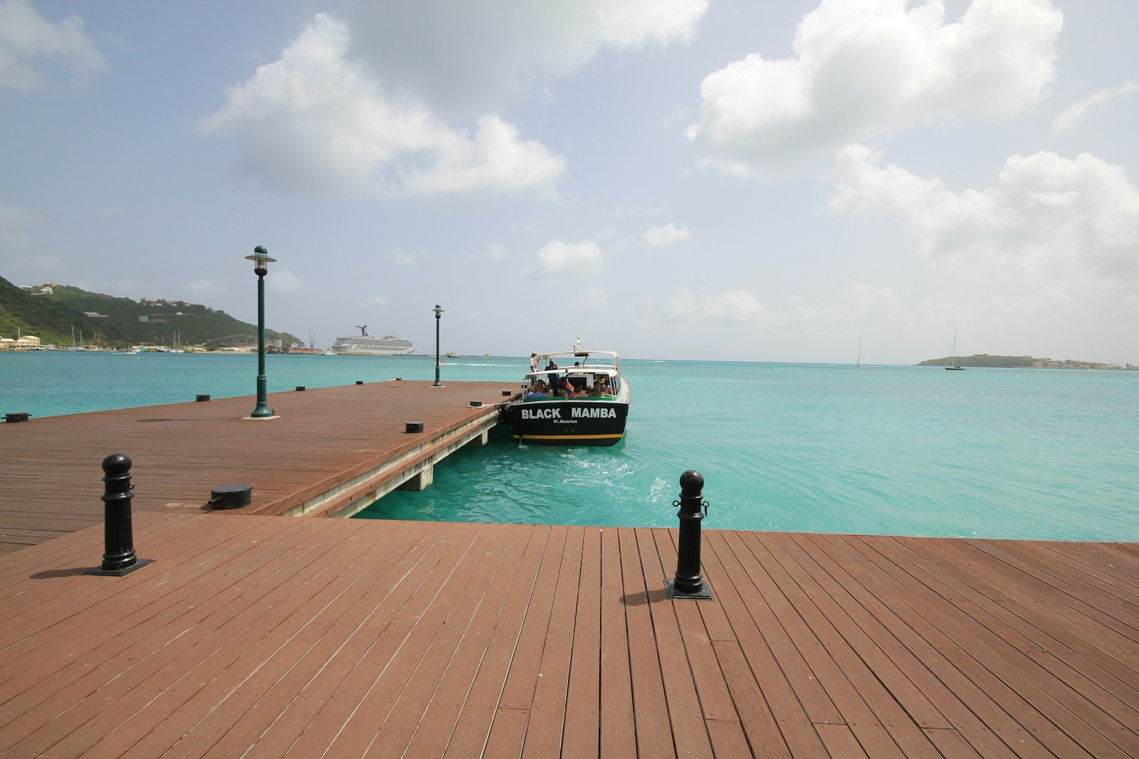 st maarten travel guide brown wooden dock on sea under blue sky during daytime