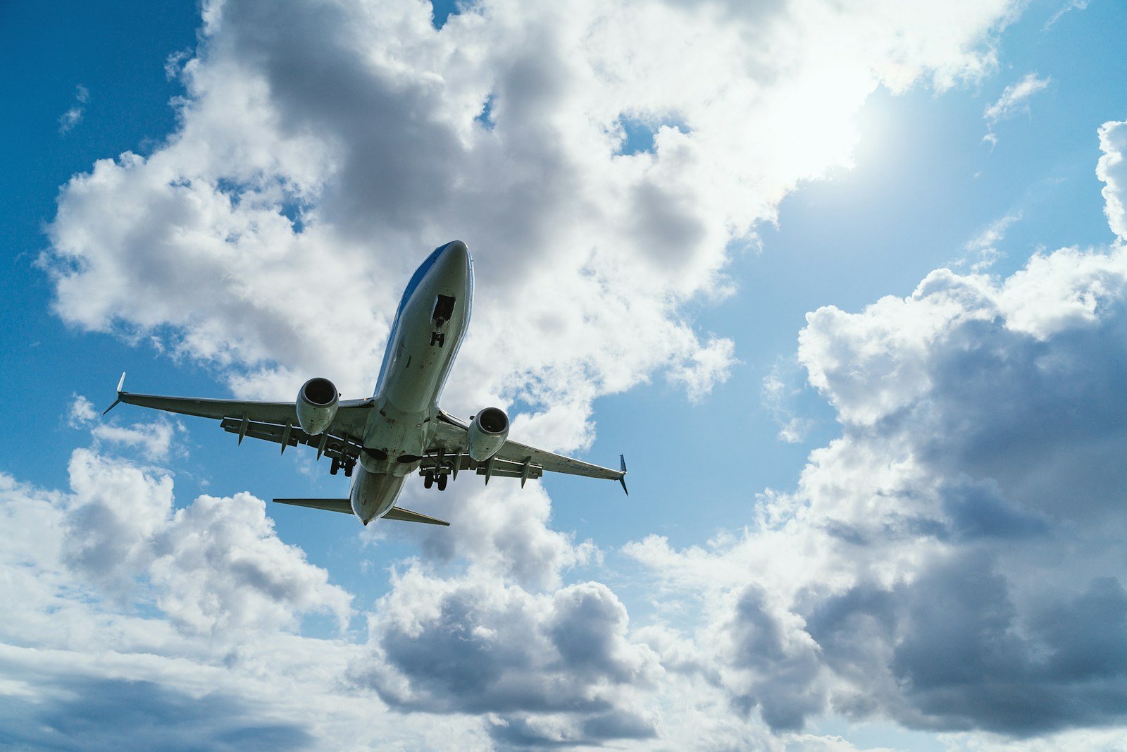 aviasales low-angle photography of airliner during flight