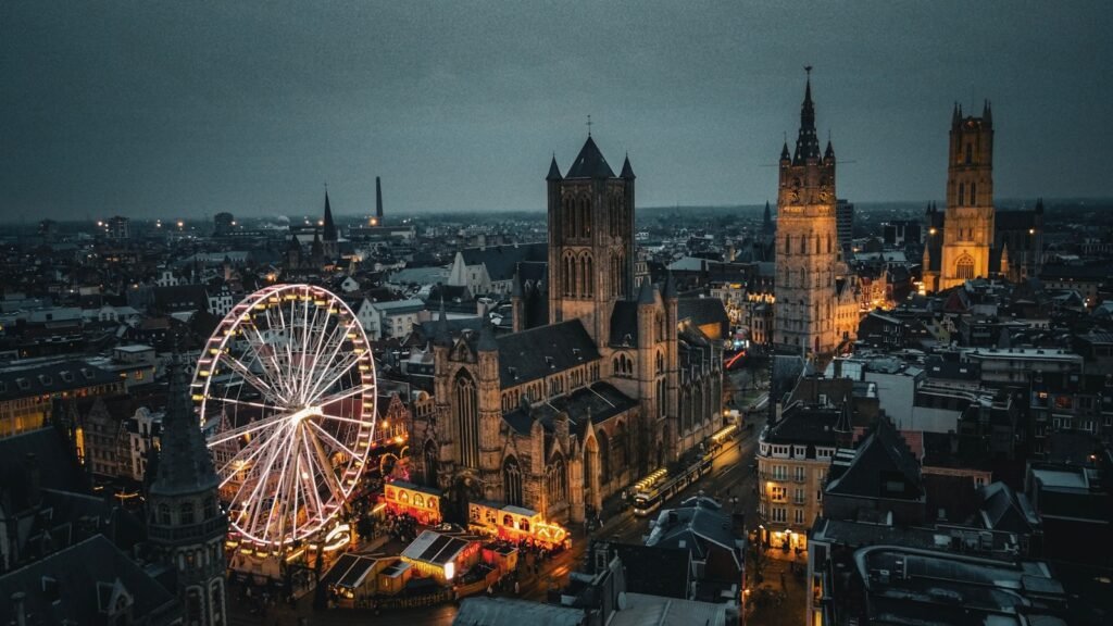 Ghent, Belgium an aerial view of a city with a ferris wheel