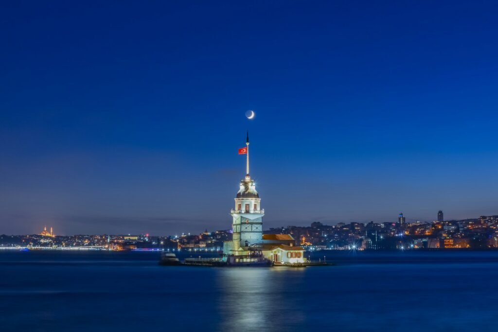 Maiden's Tower istanbul turkey white and brown concrete building near body of water during night time