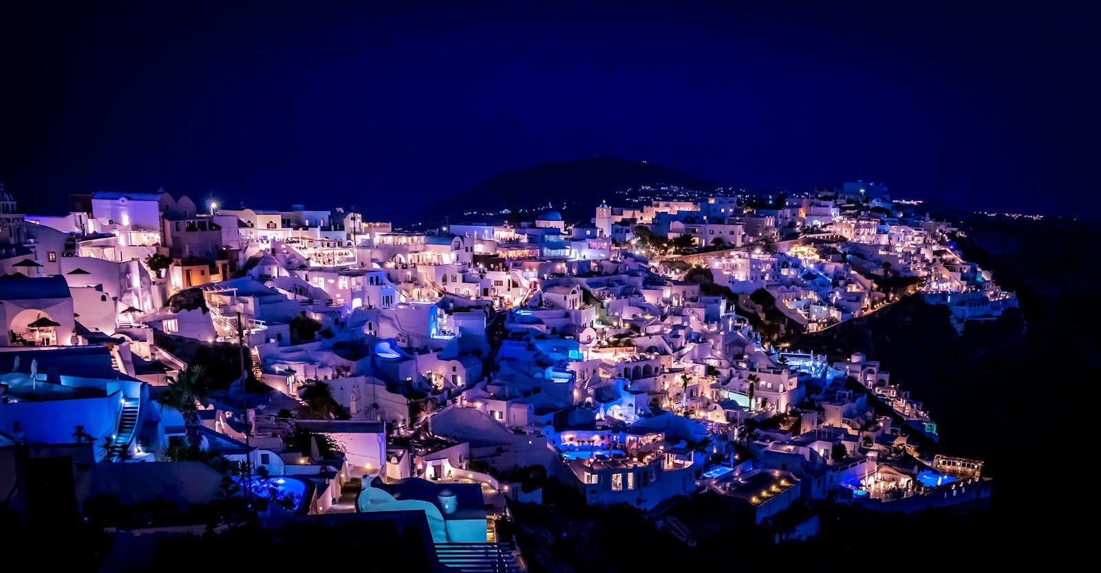 santorini travel guide lighted house during nighttime